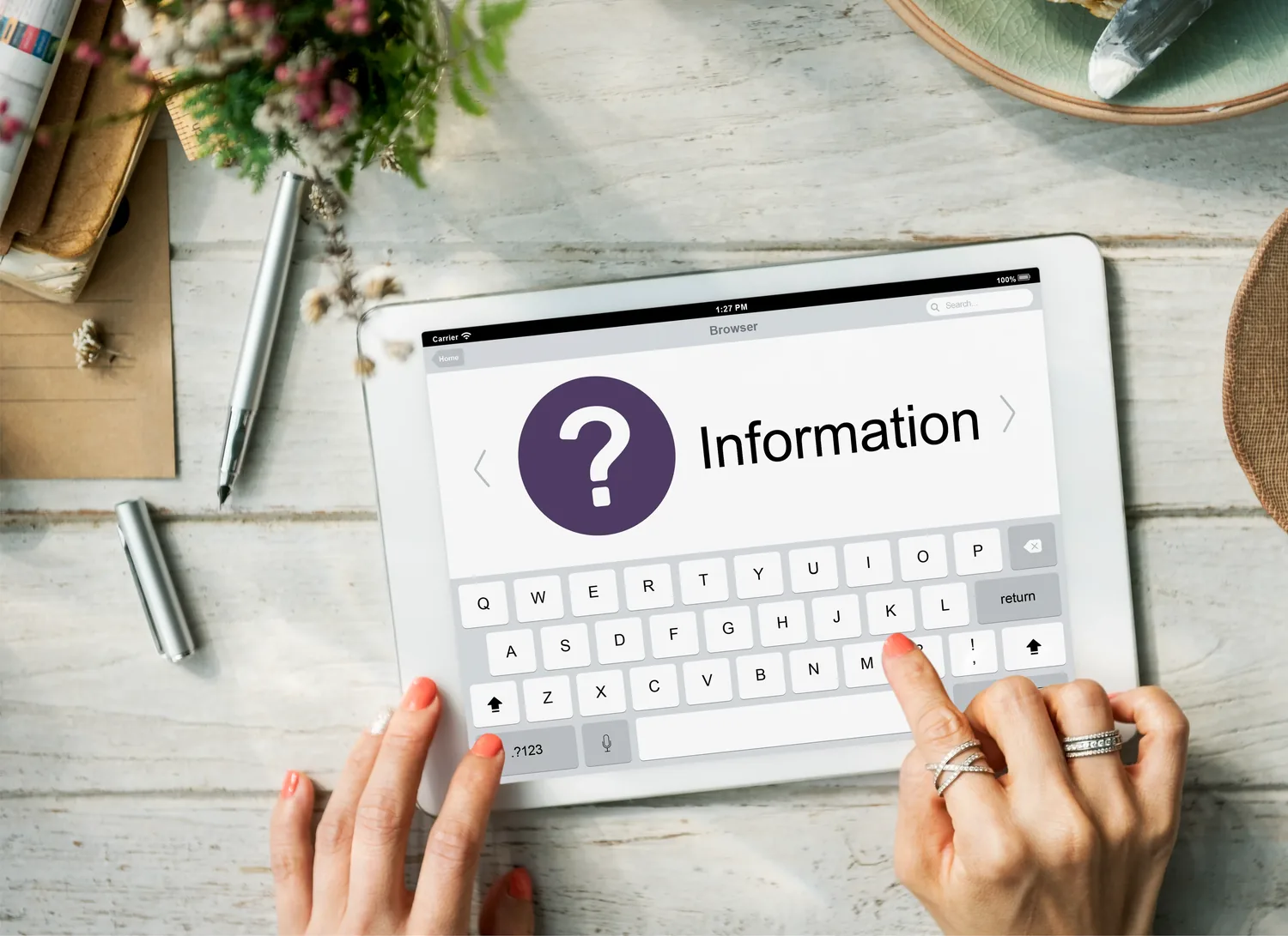 A person using a tablet displaying an information panel, representing clear and accessible information